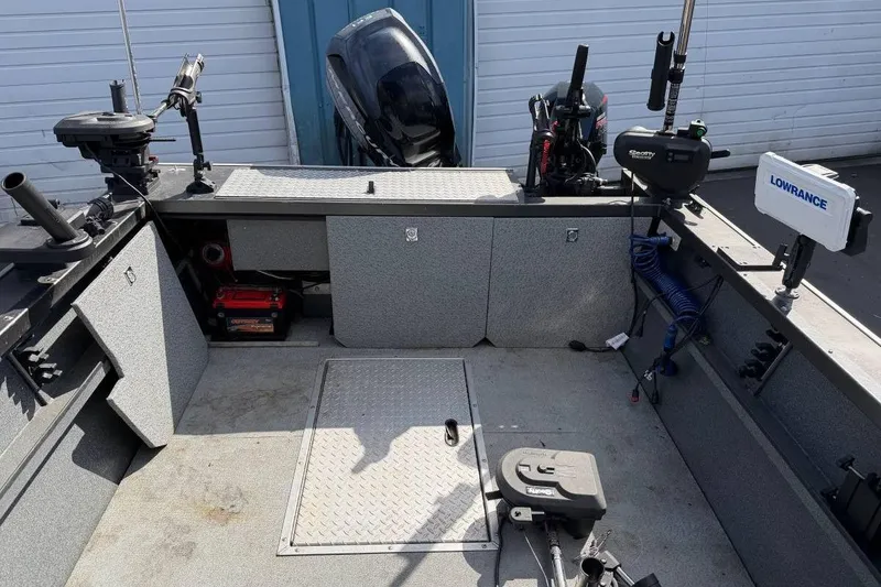 Slide: The Image of 2010 Alumaweld Blackhawk 202 boat interior with fishing equipment and Lowrance electronics. - 7