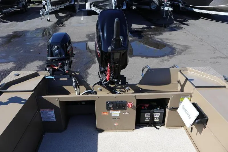 Slide: The Image of 2025 Smoker Craft Pro Sportsman 1866 boat with dual outboard motors and Garmin equipment. - 3