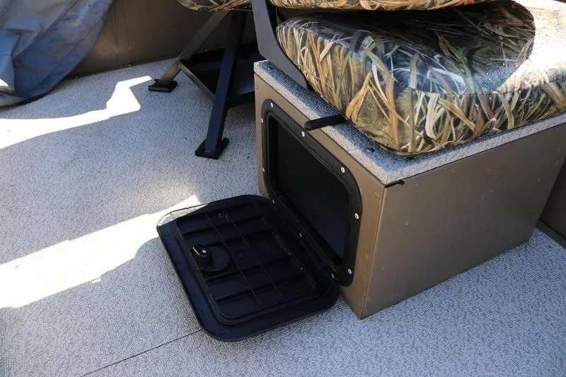 Slide: The Image of 2025 Smoker Craft Pro Sportsman 1866 boat interior with open storage compartment. - 5