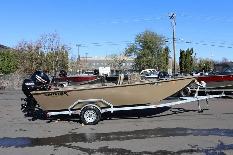 Slide: The Image of 2025 Smoker Craft Pro Sportsman 1866 boat on trailer in parking lot. - 6