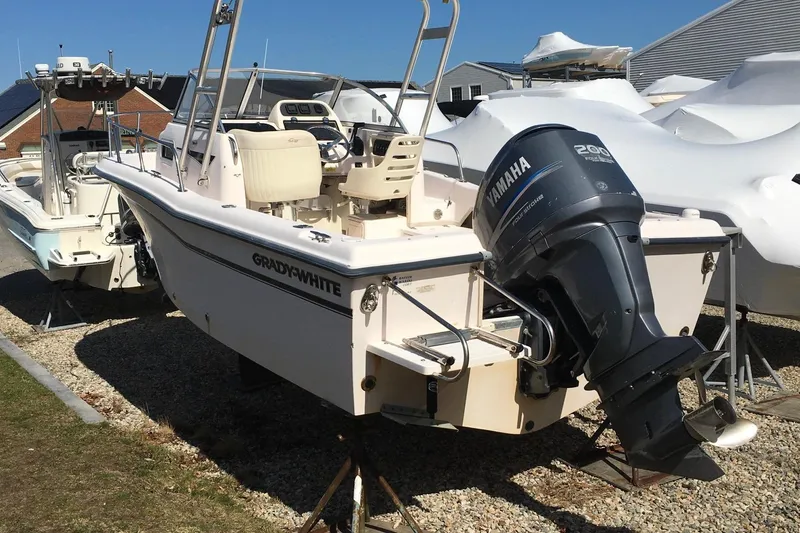 Slide: The Image of 2007 Grady-White Adventure 208 boat with Yamaha outboard motor, parked outdoors. - 4