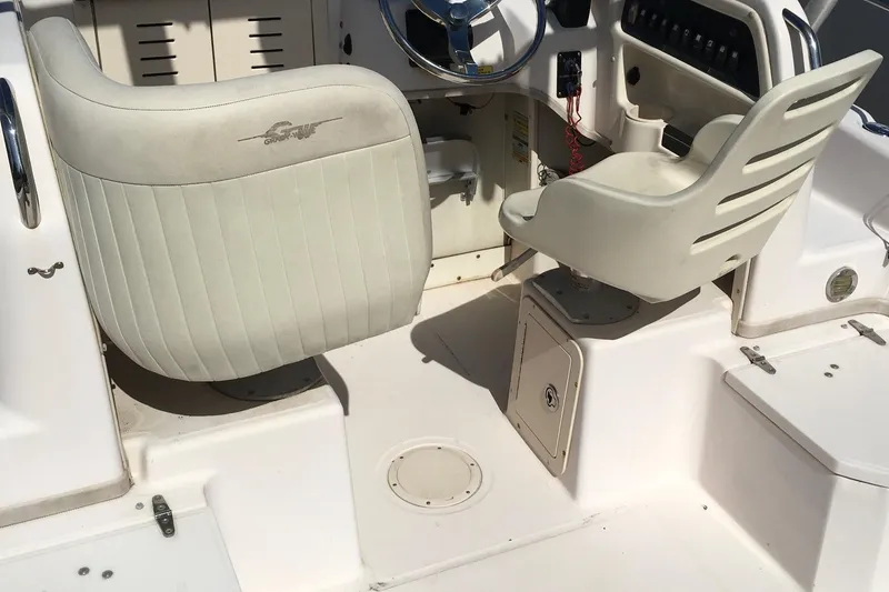 Slide: The Image of 2007 Grady-White Adventure 208 boat interior with steering wheel and seating. - 6