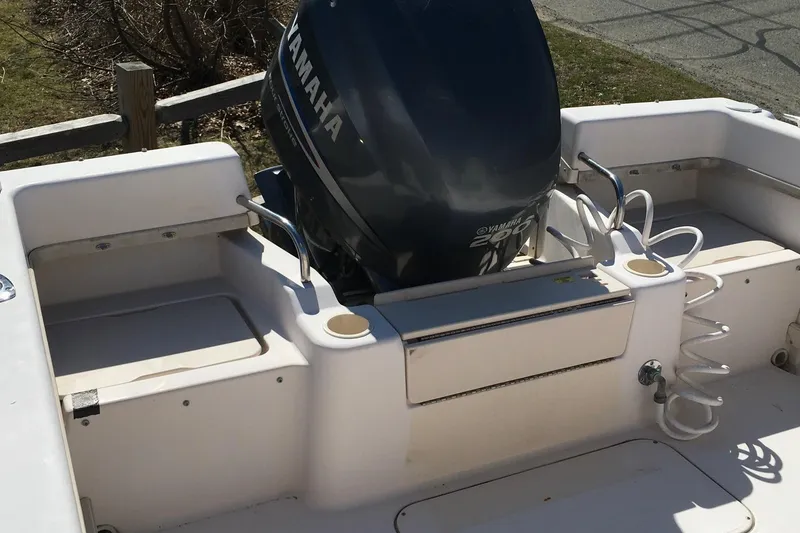 Slide: The Image of 2007 Grady-White Adventure 208 boat with Yamaha outboard motor, docked outdoors. - 7