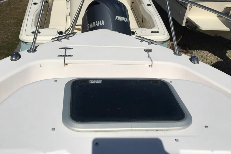 Slide: The Image of 2007 Grady-White Adventure 208 boat deck with Yamaha engine in sunlight. - 8