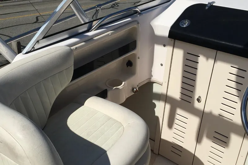 Slide: The Image of Interior of a 2007 Grady-White Adventure 208 boat, featuring seating and storage. - 9