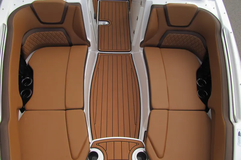 Slide: The Image of 2025 Yamaha Boats 252SD interior with tan seating and wood-style flooring. - 13