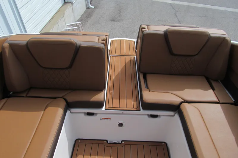 Slide: The Image of 2025 Yamaha Boats 252SD interior with brown leather seating and teak-style flooring. - 17