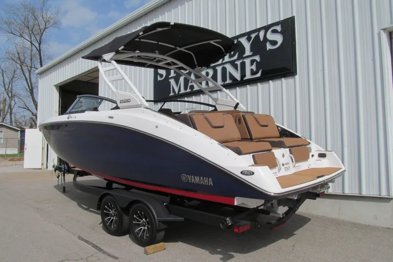 Slide: The Image of 2025 Yamaha Boats 252SD on trailer at dealership, showcasing sleek design and modern features. - 3