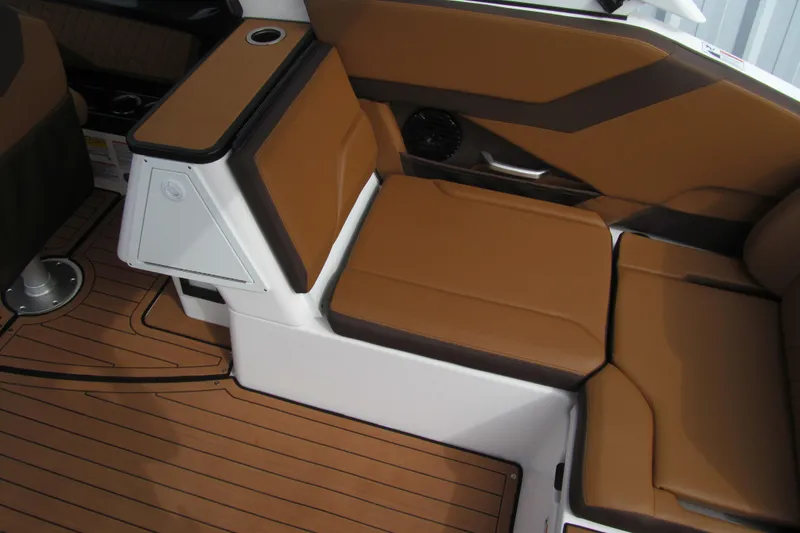 Slide: The Image of 2025 Yamaha Boats 252SD interior with brown seating and sleek design. - 6