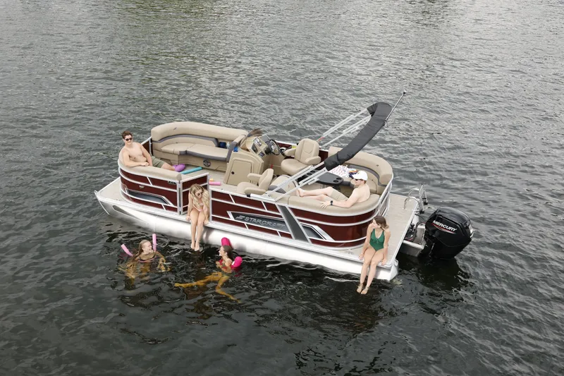 The Image of 2026 Starcraft EX 20 R pontoon boat on water with passengers. - 0