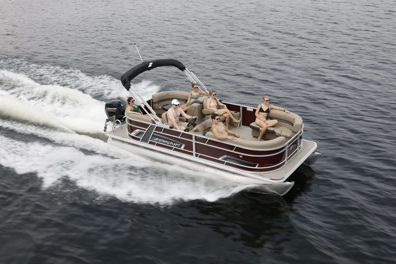 Slide: The Image of Starcraft EX 20 R pontoon boat 2026 on water with passengers. - 2