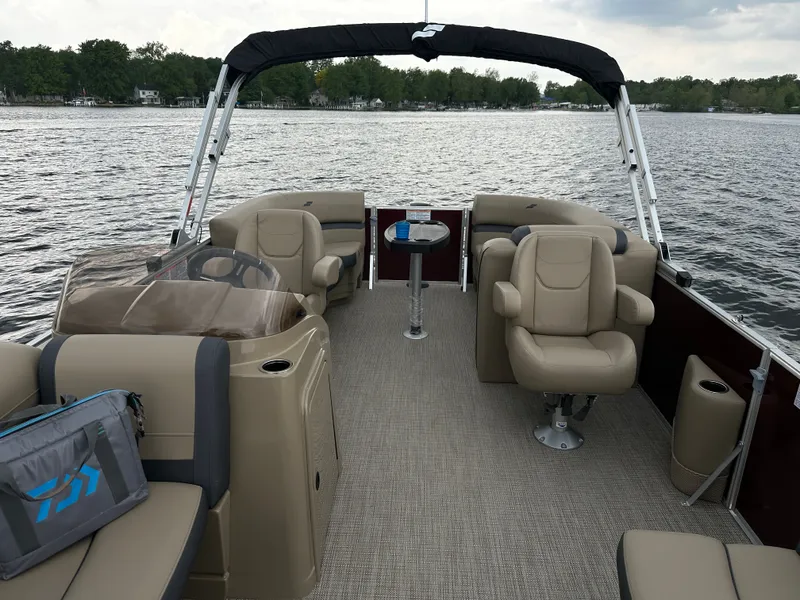 Slide: The Image of Starcraft EX 20 R 2026 pontoon boat on a serene lake. - 3