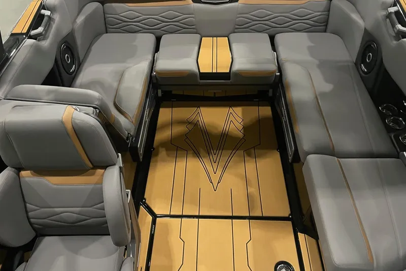Slide: The Image of Luxurious 2025 Supra SA boat interior with gray and tan seating, stylish flooring design. - 3