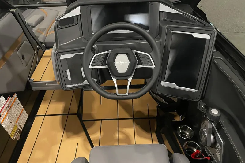Slide: The Image of 2025 Supra SA boat cockpit with modern steering wheel and digital displays. - 5