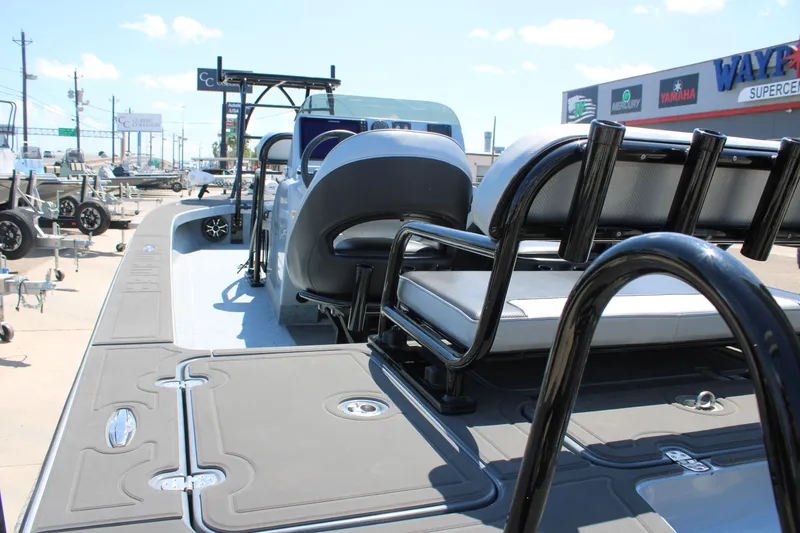 Slide: The Image of 2023 Mamba 24VX boat with speakers, displayed at a dealership under a clear sky. - 13