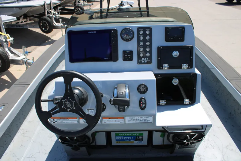 Slide: The Image of Control panel of 2023 Mamba 24VX boat with gauges and switches. - 17