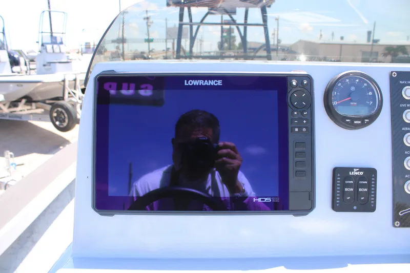 Slide: The Image of Open storage compartments on a 2023 Mamba 24VX boat, showcasing interior design. - 18