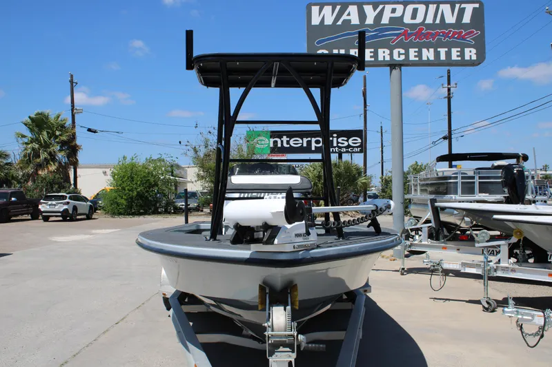 Slide: The Image of 2023 Mamba 24VX boat interior with custom seating and storage cooler. - 7