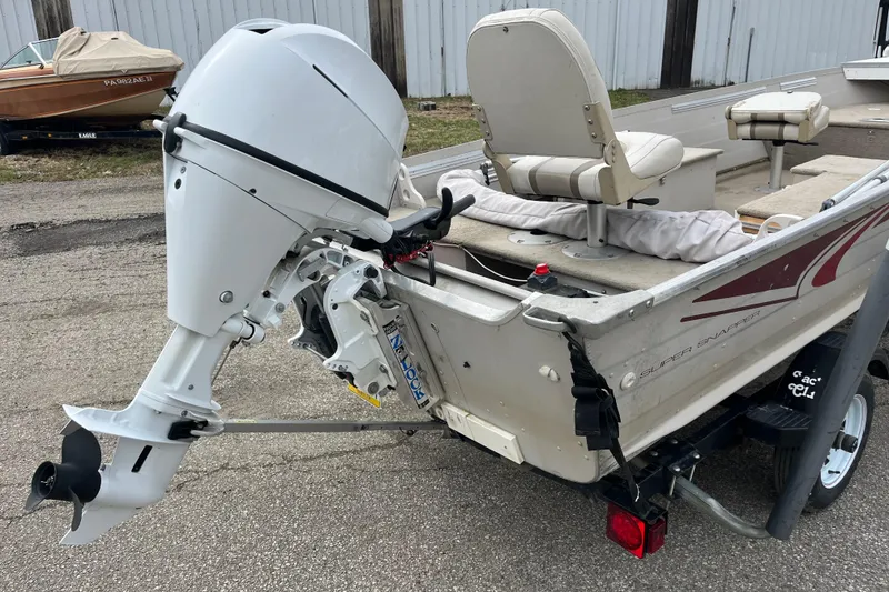 Slide: The Image of 2004 Sylvan 1600 Super Snapper boat with outboard motor and seating. - 4