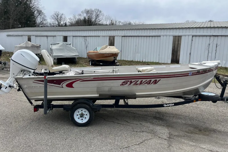Slide: The Image of 2004 Sylvan 1600 Super Snapper boat on trailer, parked outdoors. - 5