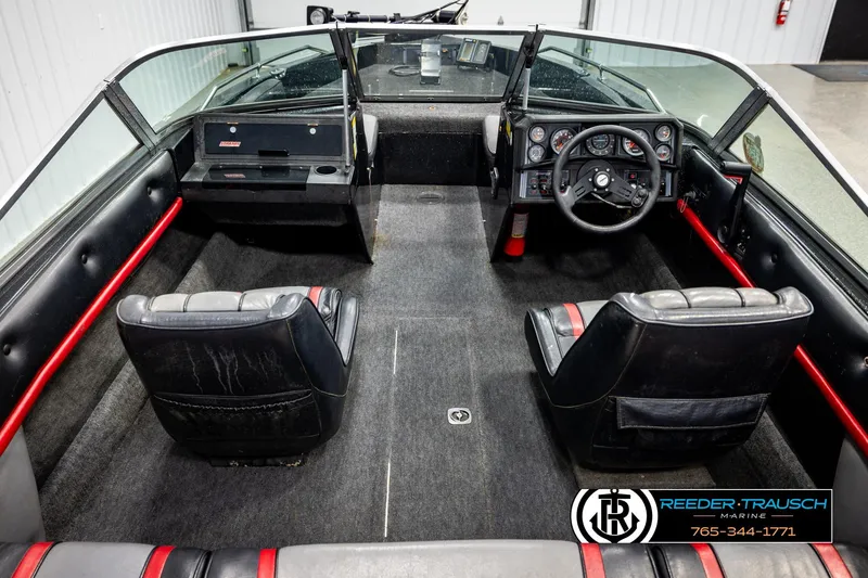 Slide: The Image of 1992 Stratos 290 Ski-N-Fish boat interior with dual seats and steering console. - 12