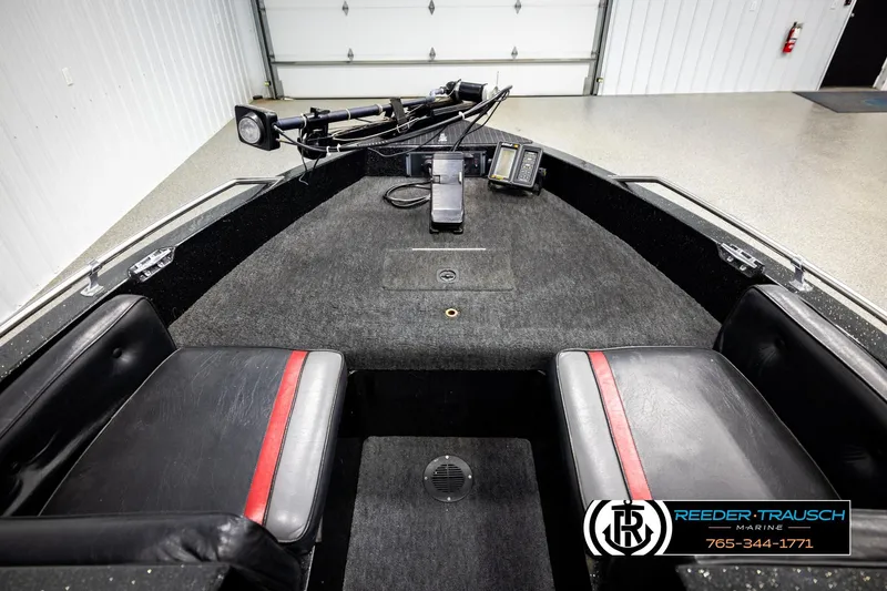 Slide: The Image of Interior of a 1992 Stratos 290 Ski-N-Fish boat with seating and control panel. - 13