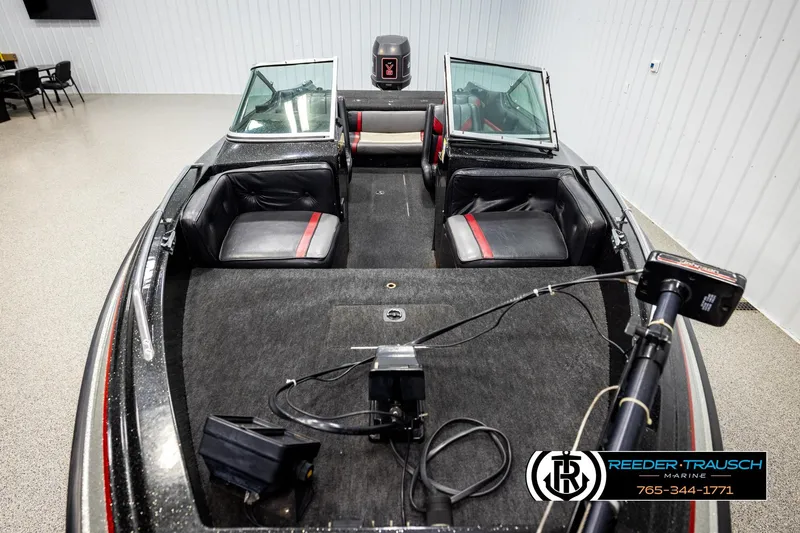 Slide: The Image of 1992 Stratos 290 Ski-N-Fish boat interior with seating and fishing equipment. - 14