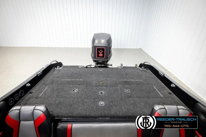 Slide: The Image of 1992 Stratos 290 Ski-N-Fish boat interior with V6 engine, featuring gray and red seating. - 16