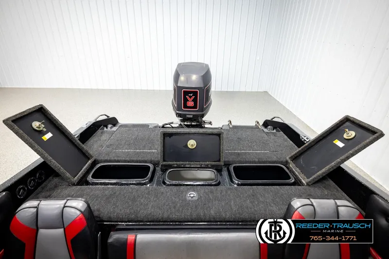 Slide: The Image of 1992 Stratos 290 Ski-N-Fish boat interior with storage compartments and V6 engine. - 17