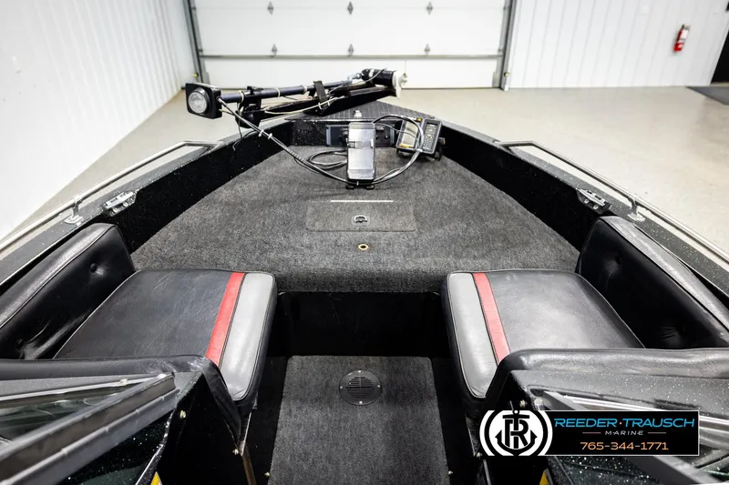 Slide: The Image of Interior of a 1992 Stratos 290 Ski-N-Fish boat with seating and control panel. - 18