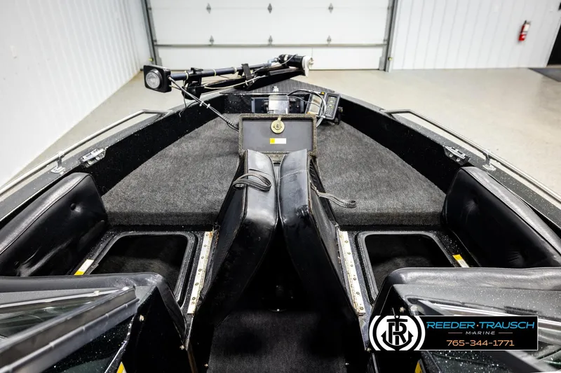 Slide: The Image of 1992 Stratos 290 Ski-N-Fish boat interior with seating and storage compartments. - 19