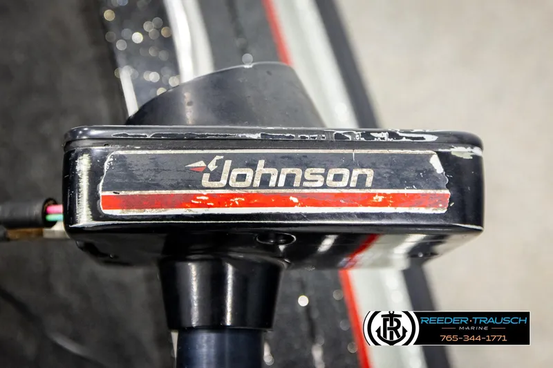 Slide: The Image of Close-up of a Johnson motor on a 1992 Stratos 290 Ski-N-Fish boat. - 23