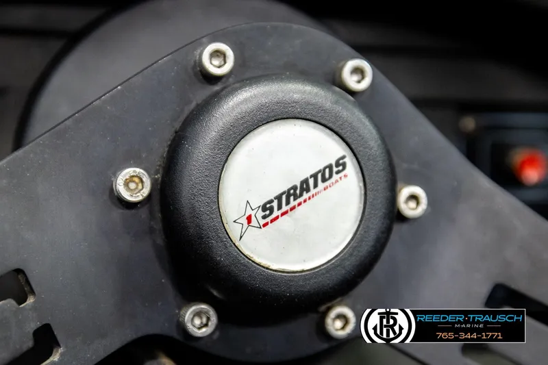 Slide: The Image of Close-up of a 1992 Stratos 290 Ski-N-Fish steering wheel with logo. - 26