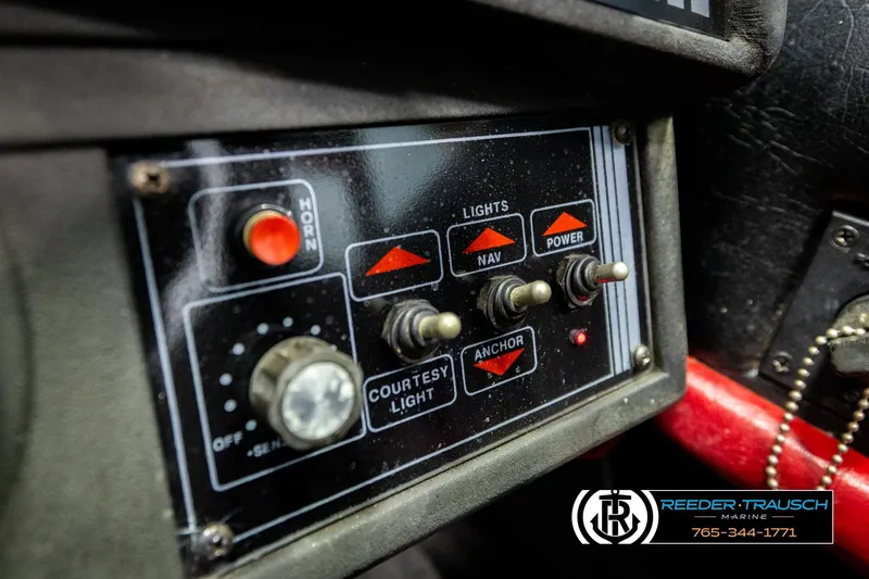 Slide: The Image of Control panel of a 1992 Stratos 290 Ski-N-Fish boat with switches and labels. - 31