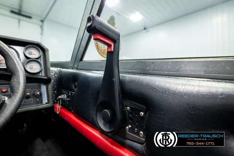 Slide: The Image of Interior of a 1992 Stratos 290 Ski-N-Fish boat, featuring dashboard and steering wheel. - 32