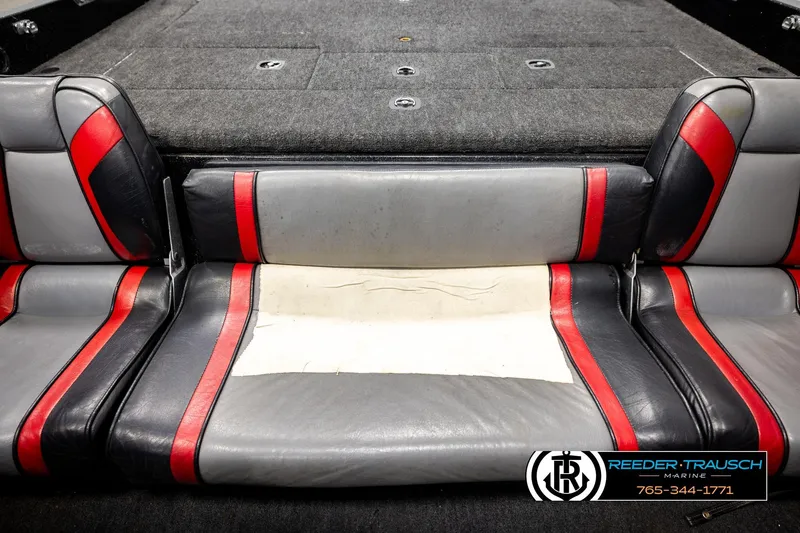 Slide: The Image of 1992 Stratos 290 Ski-N-Fish boat interior with red and gray seating. - 34