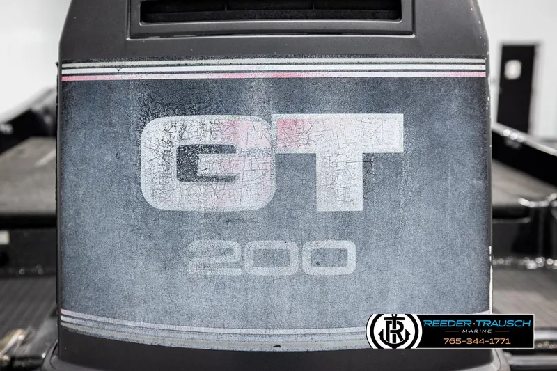 Slide: The Image of 1992 Stratos 290 Ski-N-Fish GT 200 engine cover with Reeder-Trausch Marine logo. - 39