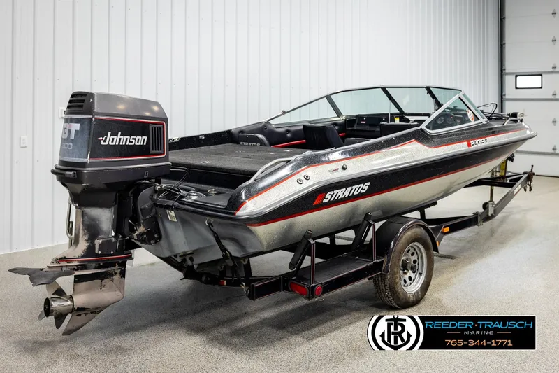 Slide: The Image of 1992 Stratos 290 Ski-N-Fish boat with Johnson outboard motor on trailer. - 4