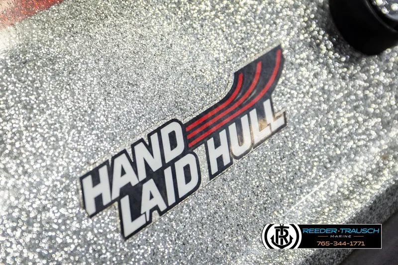 Slide: The Image of 1992 Stratos 290 Ski-N-Fish boat with hand-laid hull, Reeder-Trausch Marine logo visible. - 44