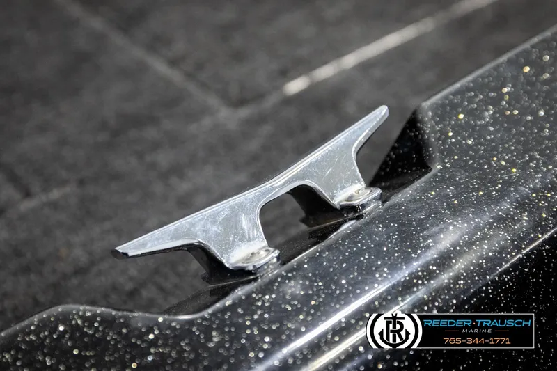 Slide: The Image of 1992 Stratos 290 Ski-N-Fish boat cleat on speckled surface, Reeder-Trausch Marine logo visible. - 45