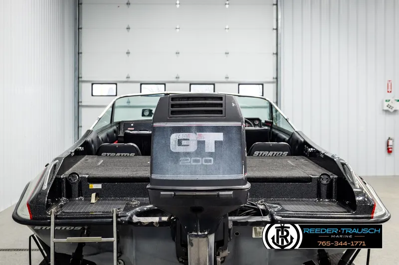 Slide: The Image of 1992 Stratos 290 Ski-N-Fish boat with GT 200 engine in a garage setting. - 5