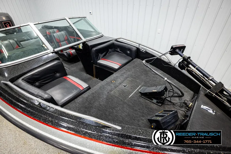 Slide: The Image of 1992 Stratos 290 Ski-N-Fish boat interior with seating and fishing equipment. - 7