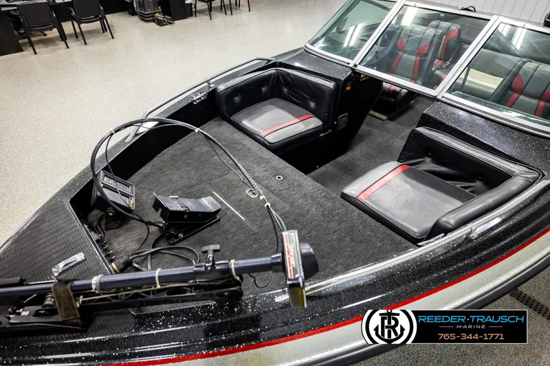 Slide: The Image of 1992 Stratos 290 Ski-N-Fish boat interior with seating and control panel. - 8