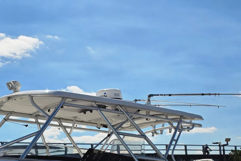 Slide: The Image of 2004 Donzi 38 ZSF boat with radar and antennas against a clear blue sky. - 18