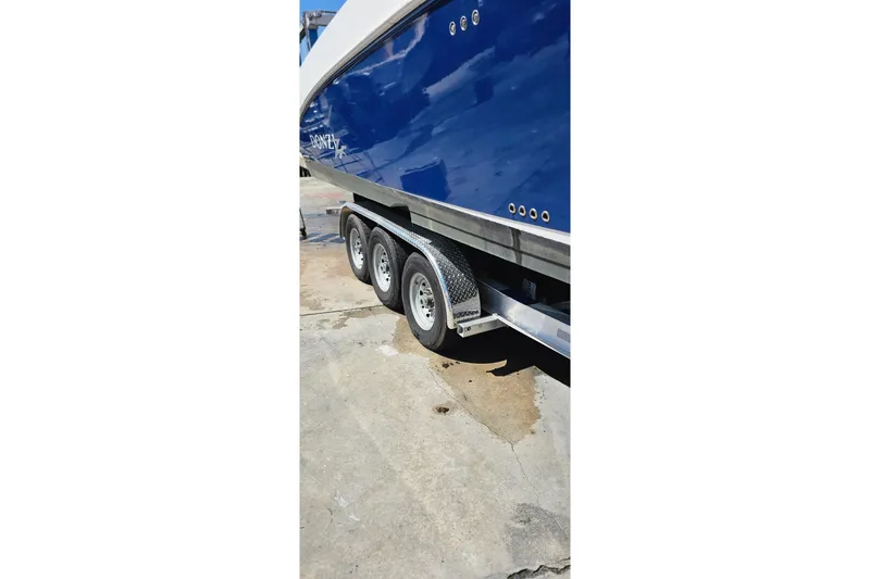 Slide: The Image of Blue 2004 Donzi 38 ZSF boat on trailer, side view. - 27