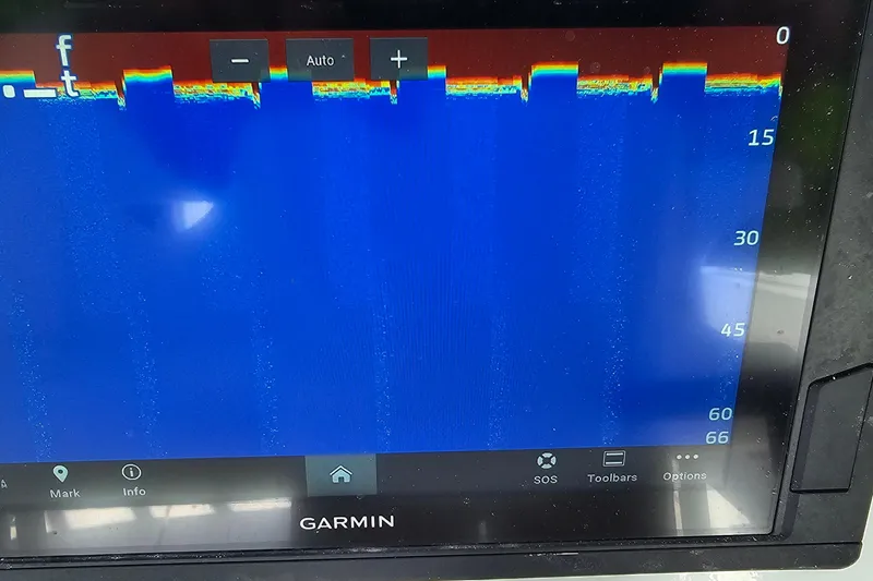 Slide: The Image of Garmin sonar display on a 2004 Donzi 38 ZSF boat, showing depth readings. - 29