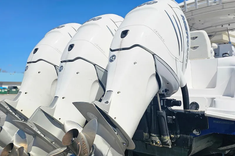 Slide: The Image of Triple outboard engines on a 2004 Donzi 38 ZSF boat, showcasing powerful propulsion. - 3