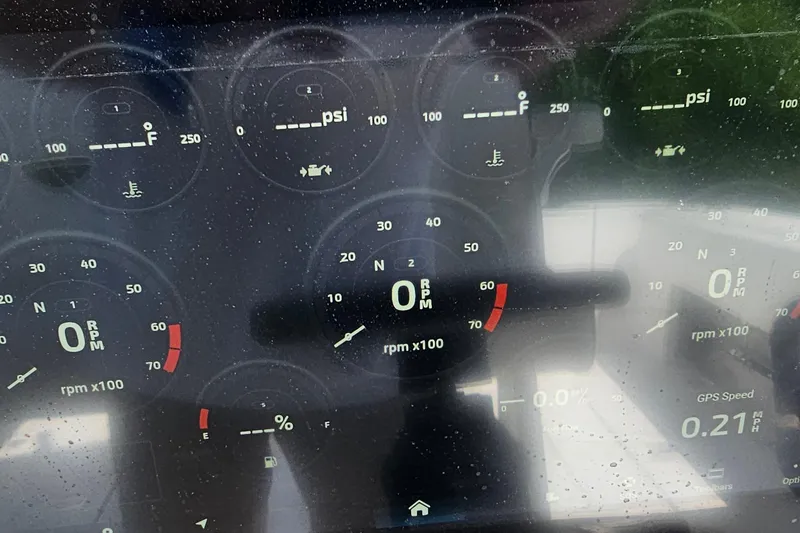 Slide: The Image of Dashboard of a 2004 Donzi 38 ZSF boat showing gauges and indicators. - 30