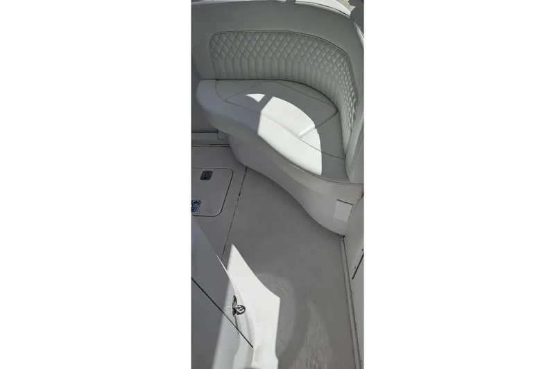 Slide: The Image of White leather seating on a 2004 Donzi 38 ZSF boat, featuring quilted upholstery. - 32