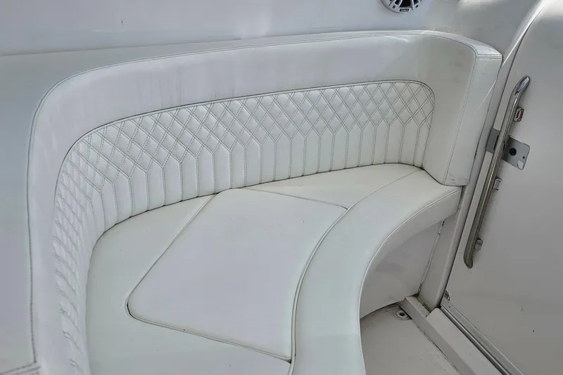 Slide: The Image of White leather seating on a 2004 Donzi 38 ZSF boat, featuring diamond stitching. - 33
